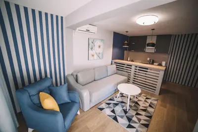 a living room with a couch and a table at Belvedere Apartments in Ulcinj