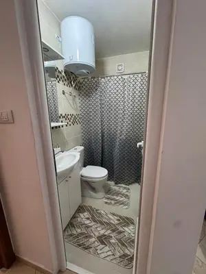 a small bathroom with a toilet and a sink at Villa Miki in Kruče
