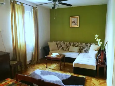 a living room with a couch and a table at Apartments Old Town in Budva