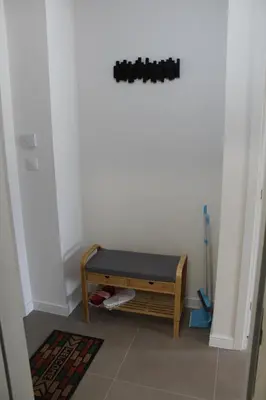a room with a bench in the corner of a room at Titograd in Podgorica