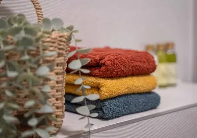 a pile of towels sitting on top of a shelf at Maxim24 in Dobrota