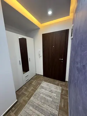 an empty room with a door and a rug at Stan Pinjes - Ulcinj in Ulcinj
