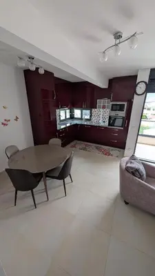 a living room with a table and a couch at Sutomore - Lux apartment 1 in Sutomore