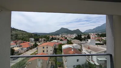 a view from a window of a city with mountains at Sutomore - Lux apartment 1 in Sutomore