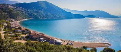 a view of a beach with mountains in the background at The best sea view in Prijevor