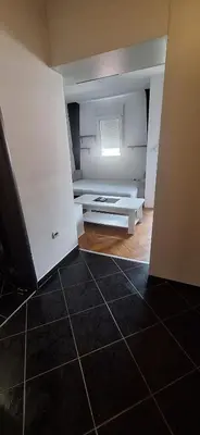 an empty room with a room with a table at Apartman Budva in Budva