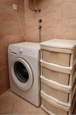 a washer and dryer in a small room at Seaside Nest Budva -Cozy Retreat 3 min from Beach in Budva