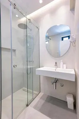 a bathroom with a sink and a shower at Lucciola Boutique Rooms in Budva