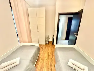 a small room with two beds and a mirror at Two bedroom apartment Andrej in Budva