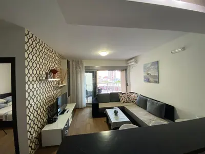 a living room with a couch and a table at Dragan Apartment in Budva