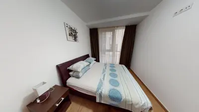 a small bedroom with a bed and a window at Dragan Apartment in Budva