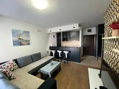 a living room with a couch and a table at Dragan Apartment in Budva