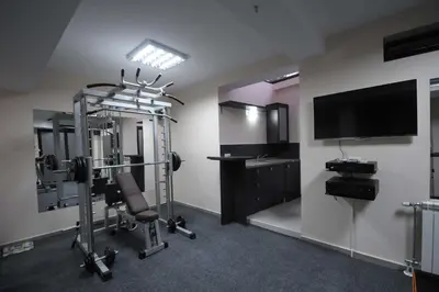 a room with a gym with a flat screen tv at Villa Dragana in Budva