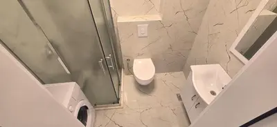 a bathroom with a shower and a toilet and a sink at Apartmani Banović 3 - Ulcinj, Velika plaža in Ulcinj