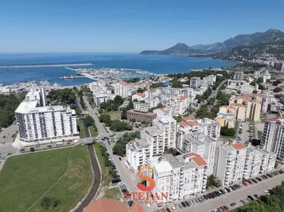 an aerial view of a city with buildings and the ocean at Apartmani Stefan in Bar