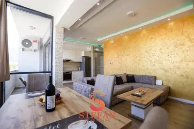 a living room with a couch and a table at Apartmani Stefan in Bar