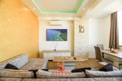 a living room with a couch and a table at Apartmani Stefan in Bar