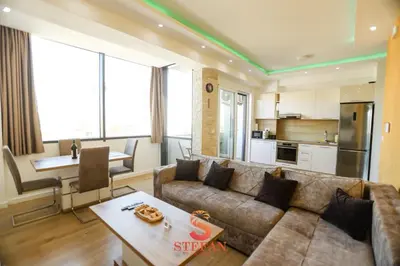 a living room with a couch and a table at Apartmani Stefan in Bar