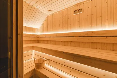 a wooden sauna with a trash can in it at Villa Boscovich in Katun