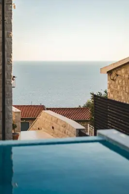 a swimming pool with a view of the ocean at Villa Boscovich in Katun