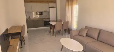 a living room with a couch and a table at Apartmani Banović 2 - Ulcinj, Velika plaža in Ulcinj