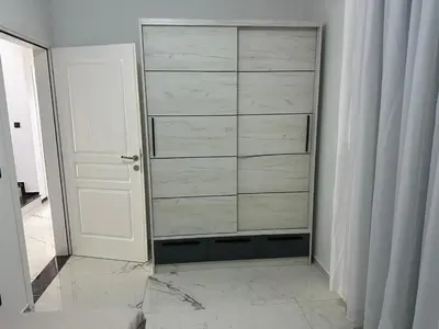 a closet with a dresser in a room at Villa Zaljevo in Bar