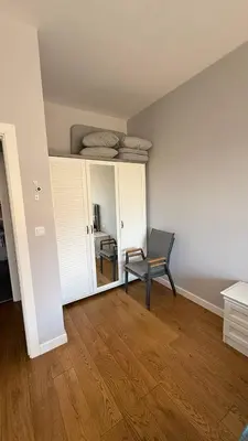 a empty room with a chair and a mirror at Soho Stay in Bar