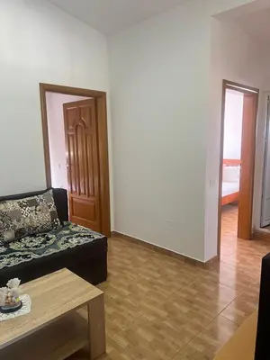 a living room with a couch and a table at Halili Apartments in Ulcinj