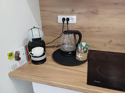 a counter with a blender and a coffee maker on it at Utjeha Hills with Pool in Bar
