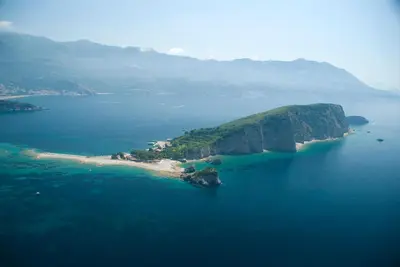 an island in the middle of a large body of water at Summer Nest Studio in Becici in Becici