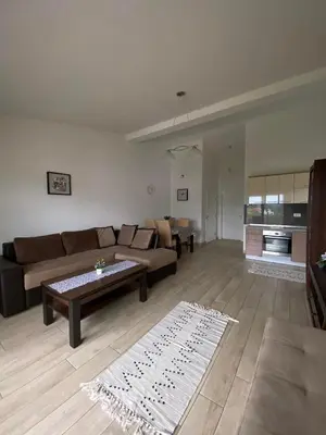 a living room with a couch and a table at MARSHAL Apartments in Donji Štoj