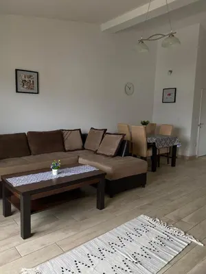 a living room with a couch and a coffee table at MARSHAL Apartments in Donji Štoj