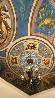 a chandelier hanging from the ceiling of a room at Royal House in Kotor