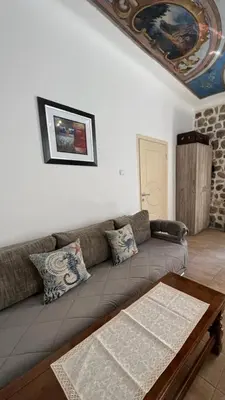 a living room with a couch and a table at Royal House in Kotor