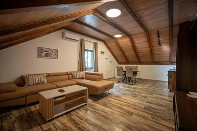 a living room with a couch and a table at Agape Apartments in Kotor