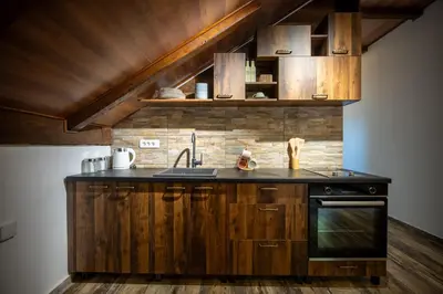 a kitchen with a sink and a stove at Agape Apartments in Kotor