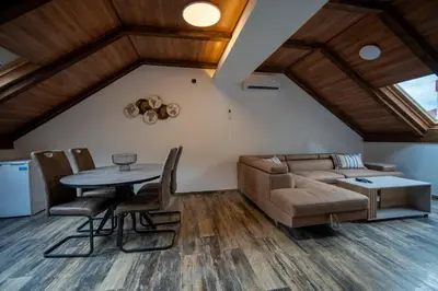 a living room with a couch and a table at Agape Apartments in Kotor