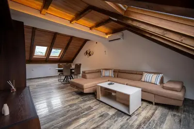 a living room with a couch and a table at Agape Apartments in Kotor