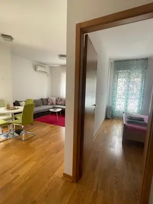a living room with a couch and a table at District Loft in Podgorica