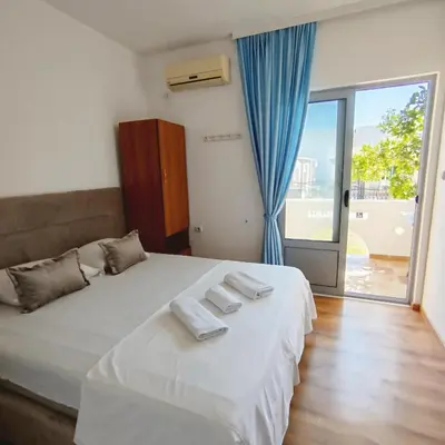 a bedroom with a bed with two towels on it at Apartments Hija in Donji Štoj
