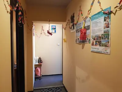 a hallway with christmas decorations on the wall at Доброморе Будва in Budva