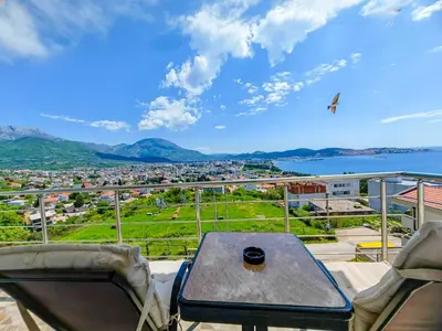a table and chairs on a balcony with a view at Zora Apartments in Bar