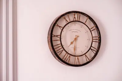 a clock is hanging on a wall at Mia Studio Apartment in Budva