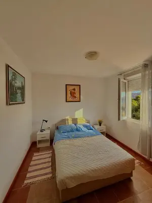 a bedroom with a bed and a window at Porta Mare Apartment in Bar
