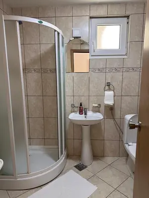 a bathroom with a shower and a sink at Summer Dreams Apartment in Budva