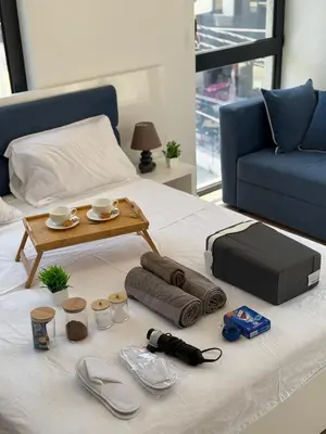 a bed with a coffee table on top of it at Adam & Eve Family Apartment in Dobra Voda