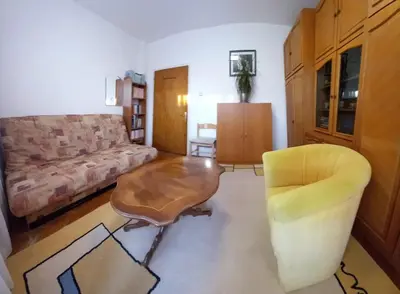 a living room with a couch and a coffee table at Apartman Centar in Petrovac na Moru