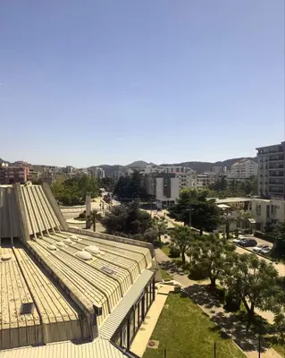 a roof of a building with a city in the background at Royal Central Apartment in Bar