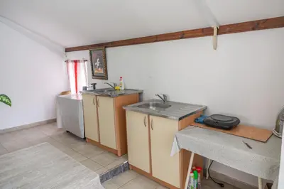 a kitchen with a sink and a counter top at Beach Center in Ulcinj