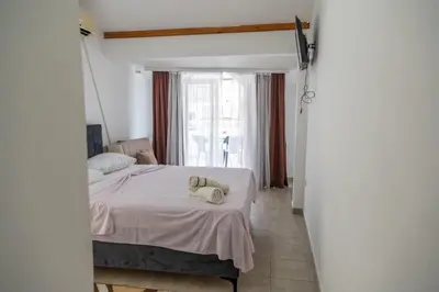 a bedroom with a bed with a pillow on it at Beach Center in Ulcinj